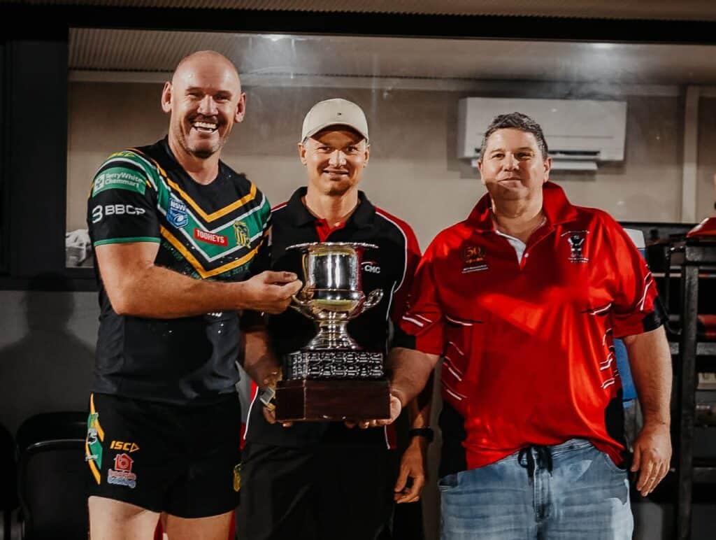 CMC presenting the Orange CYMS team with the winning trophy